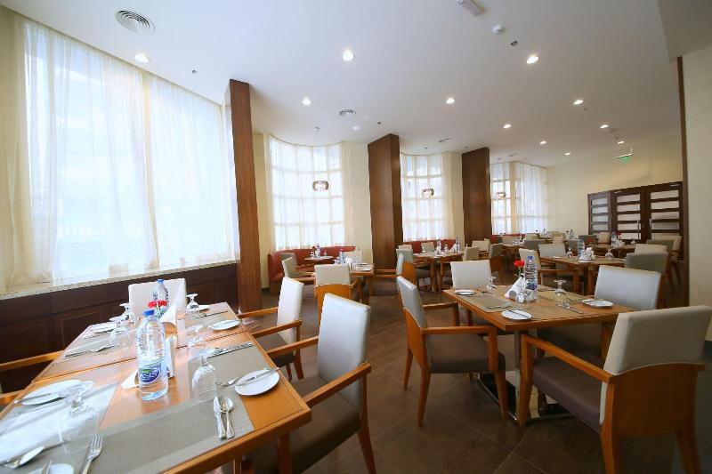 Lavender Hotel by Gloria Hotels and Resorts - Restoran