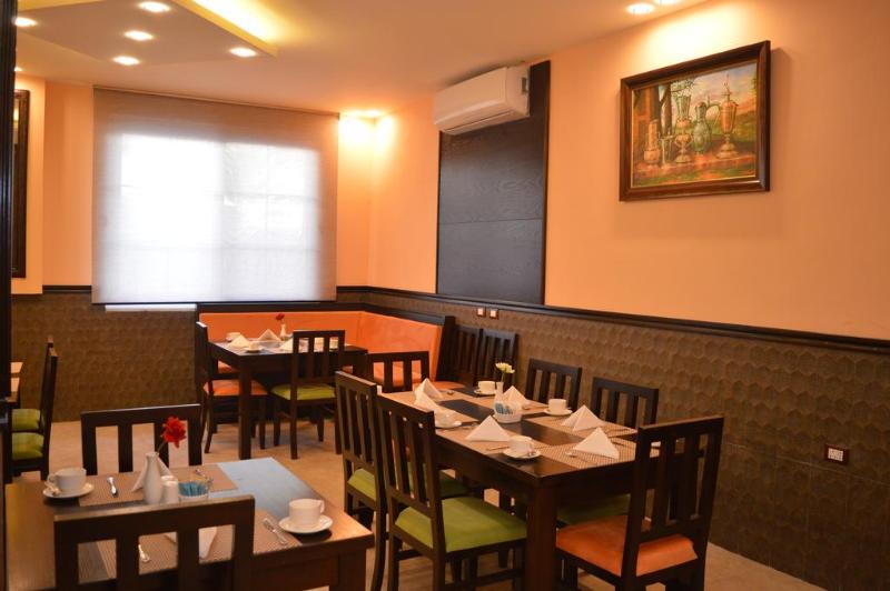 Tilal Almadina Hotel - Restoran