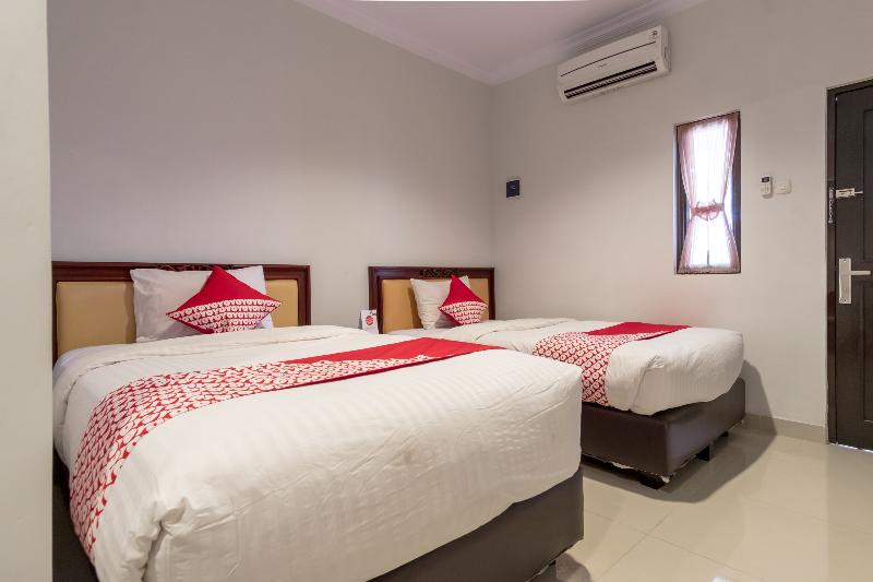 Super OYO 283 Helvetia Residence - Oda