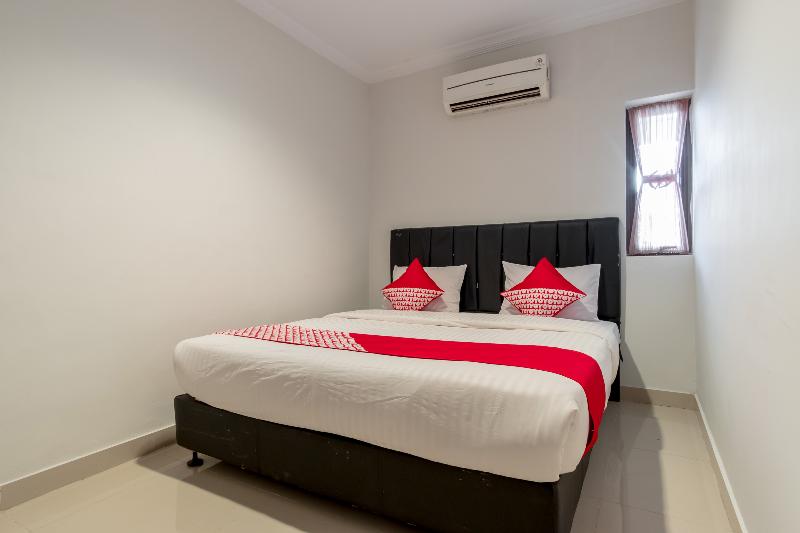 Super OYO 283 Helvetia Residence - Oda