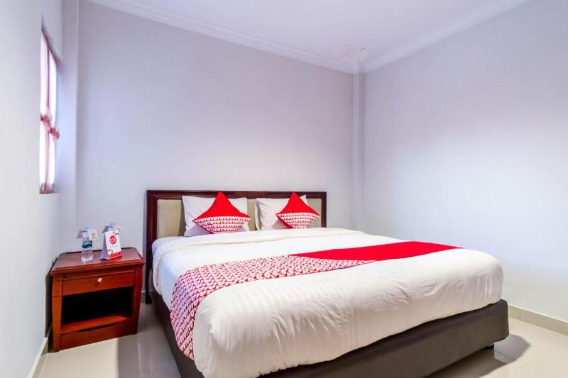 Super OYO 283 Helvetia Residence - Oda