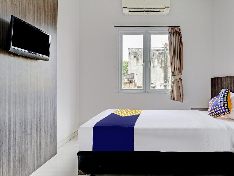 SPOT ON 90777 D’river Guest House - Oda
