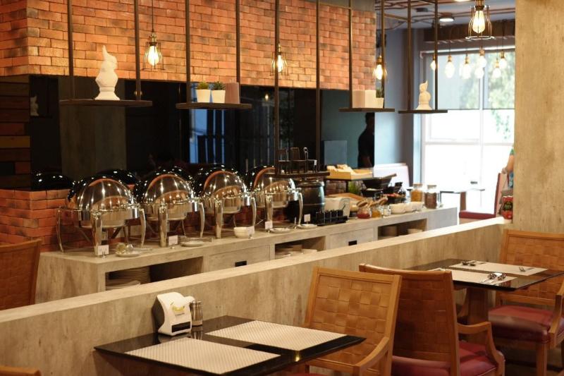 The Sunreno Serviced Apartment - Restoran