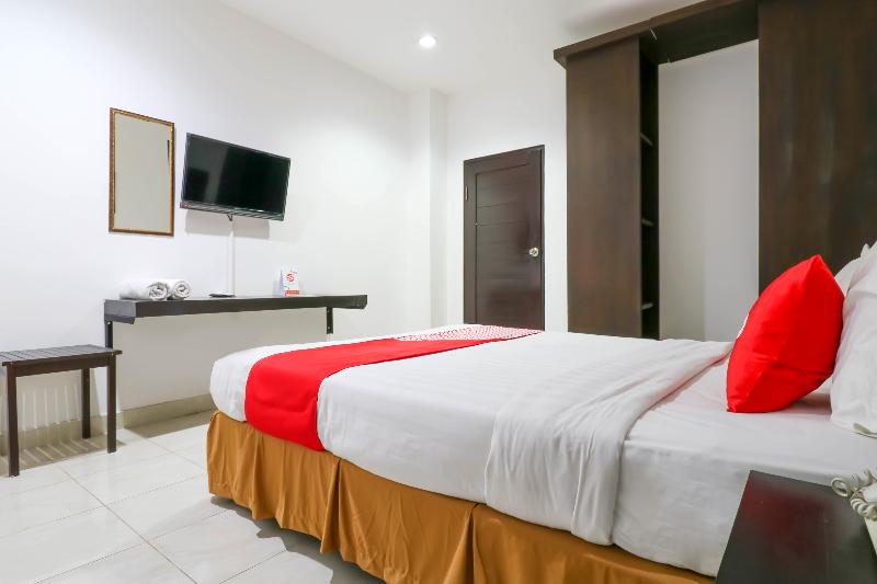Capital O 1666 Grand Pudjawan Hotel - Oda