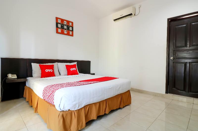 Capital O 1666 Grand Pudjawan Hotel - Oda