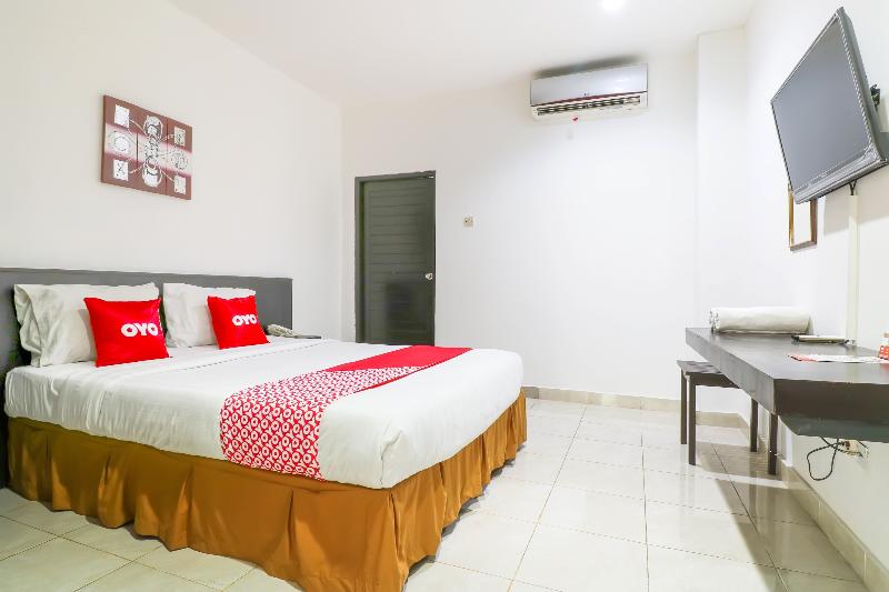 Capital O 1666 Grand Pudjawan Hotel - Oda