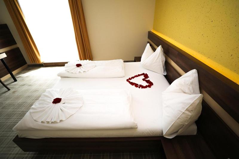 Primus Hotel & Apartments - Oda