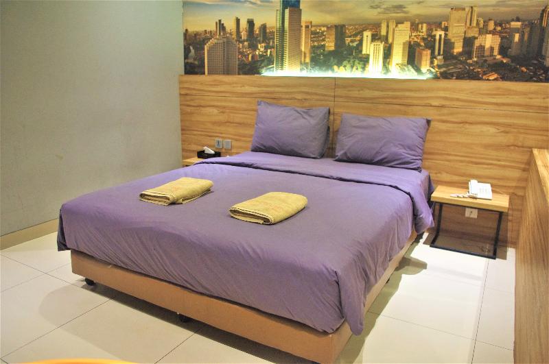 Orange Inn Hotel Mangga Besar by ZUZU - Oda