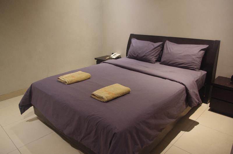 Orange Inn Hotel Mangga Besar by ZUZU - Oda