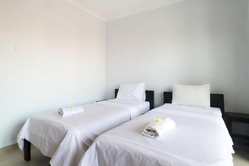 The Wina Echo Beach Guesthouse by ZUZU - Oda