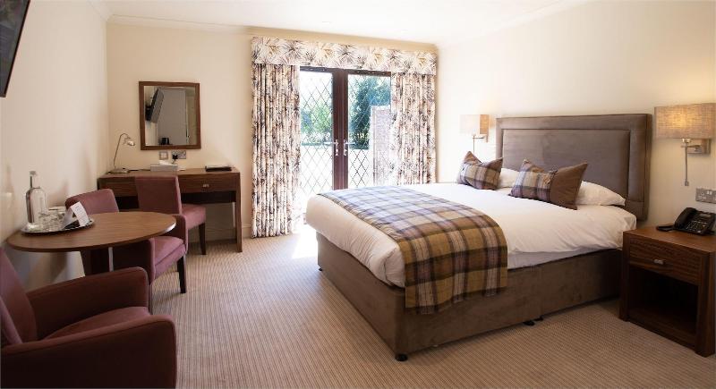 Stirrups Hotel - Oda