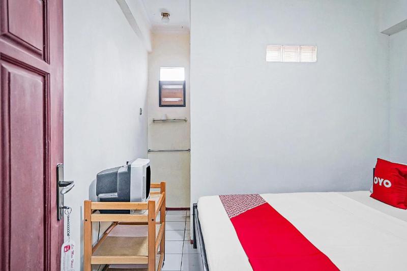 OYO 90132 Lie Mas Hotel - Oda