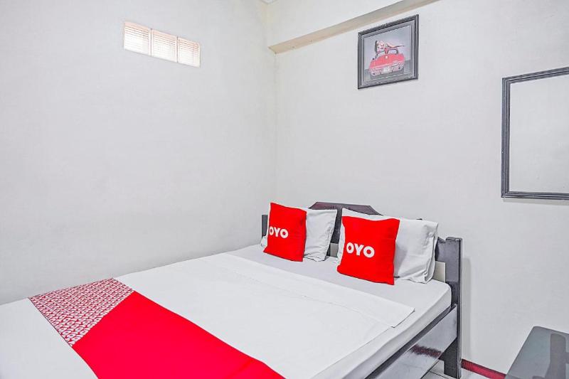 OYO 90132 Lie Mas Hotel - Oda