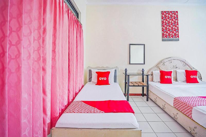 OYO 90132 Lie Mas Hotel - Oda