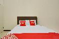 OYO 90684 Happy Homestay Syariah oda fotoğrafı