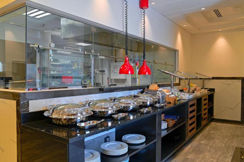 TIME Moonstone Hotel Apartments - Restoran