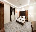 Al Qasr Hotel Suites - Al Iskan District oda fotoğrafı
