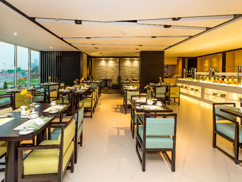 Flora Creek Deluxe Hotel Apartments - Restoran