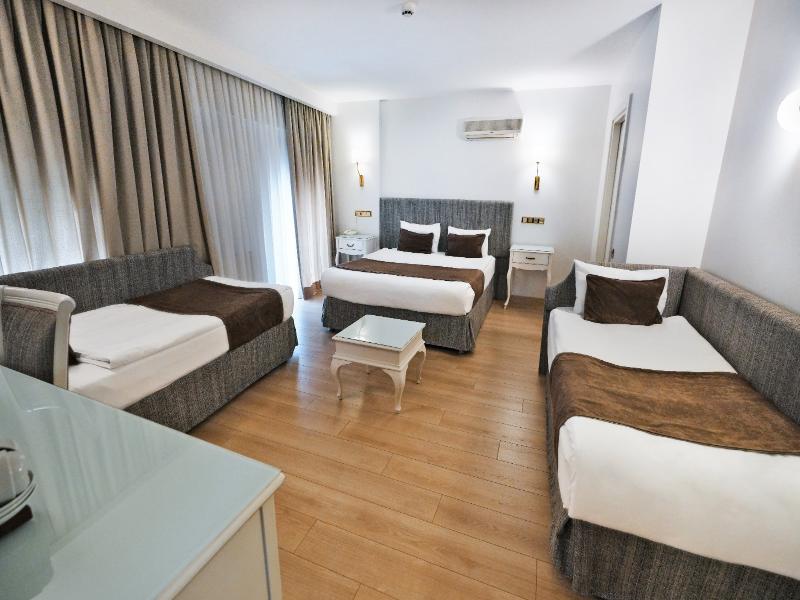 Taximtown Hotel - Oda