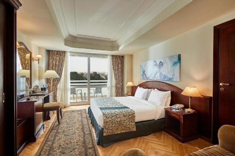 Triumph Plaza Hotel - Oda
