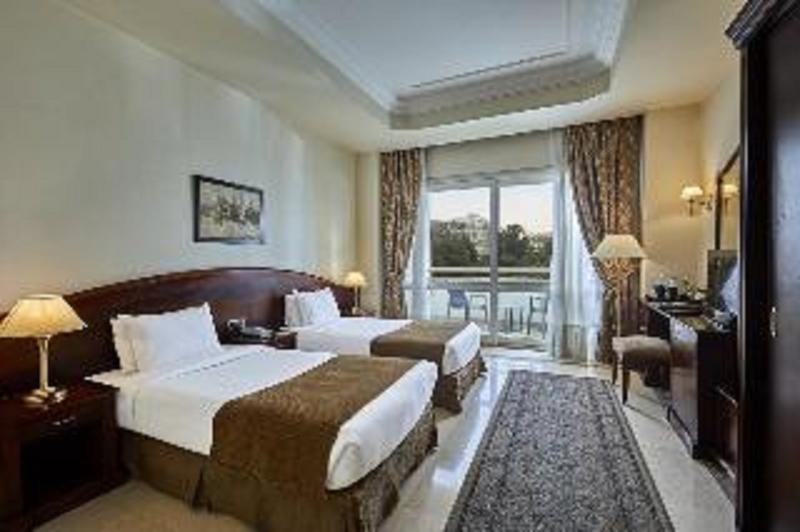 Triumph Plaza Hotel - Oda
