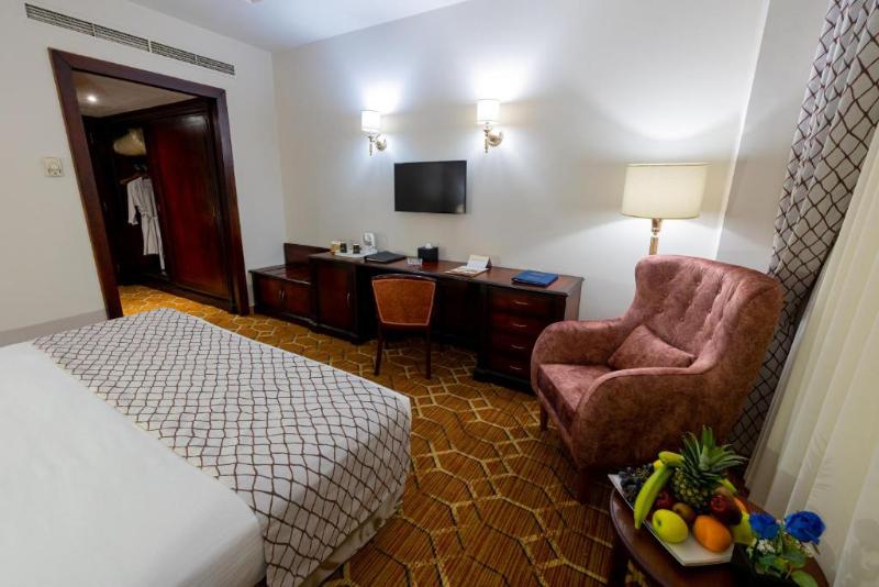 Triumph Plaza Hotel - Oda