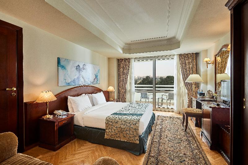 Triumph Plaza Hotel - Oda