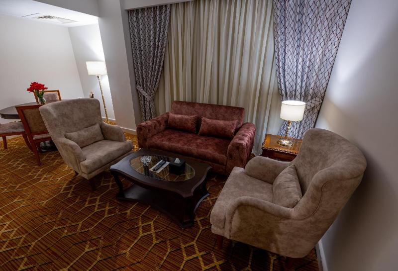 Triumph Plaza Hotel - Oda