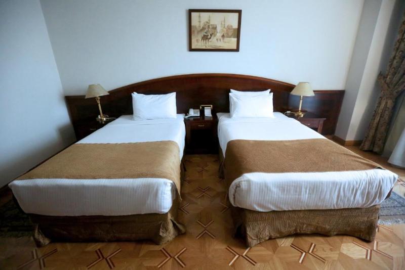 Triumph Plaza Hotel - Oda