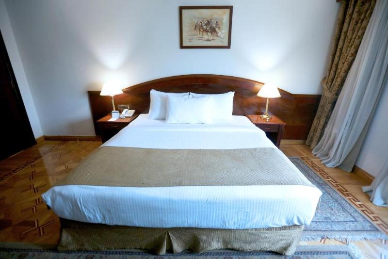 Triumph Plaza Hotel - Oda