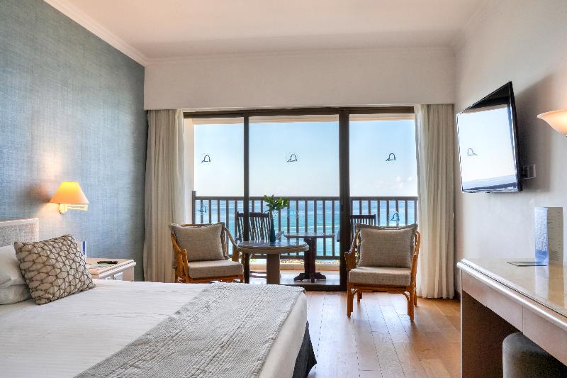 Coral Beach Hotel and Resort - Oda
